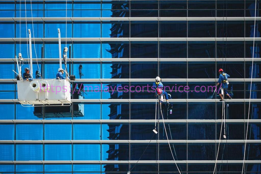 Window washers cleaning a modern skyscraper.