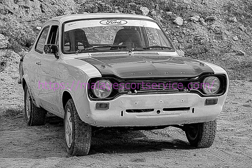 Black and white photo of a vintage Ford Escort rally car.