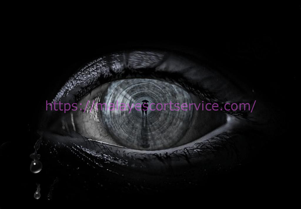 Close-up of a crying eye, reflecting a dark tunnel.