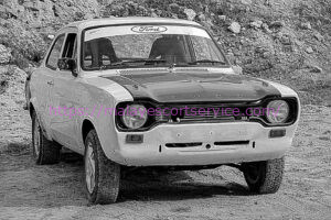 Black and white photo of a vintage Ford Escort rally car.